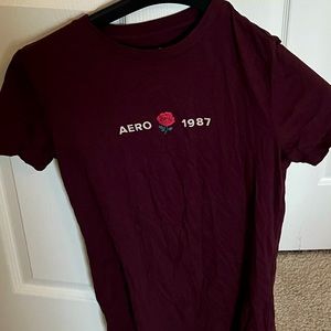 Tight fitted, purple/pinkish t-shirt